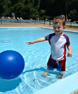 In the baby pool at our new pool. He's not yet decided to go "all in".